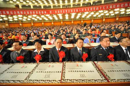 Chinese President Hu Jintao said here Monday the successful hosting of the Beijing Olympics and Paralympics symbolizes China's capability of making more contributions to the human civilization. 
